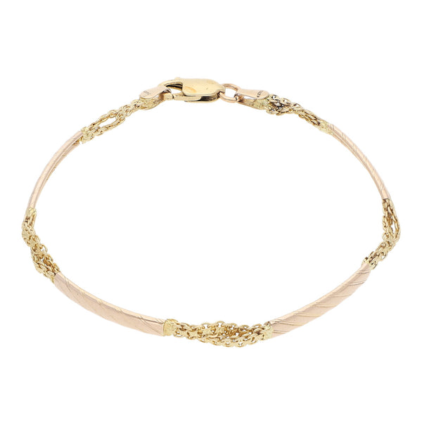 Pulsera eslabón articulado en oro dos tonos 14 kilates.
