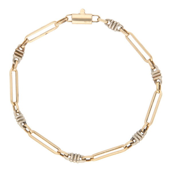 Pulsera eslabón combinado en oro dos tonos 14 kilates.