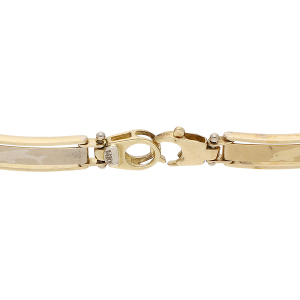 Pulsera eslabón articulado en oro dos tonos 14 kilates.