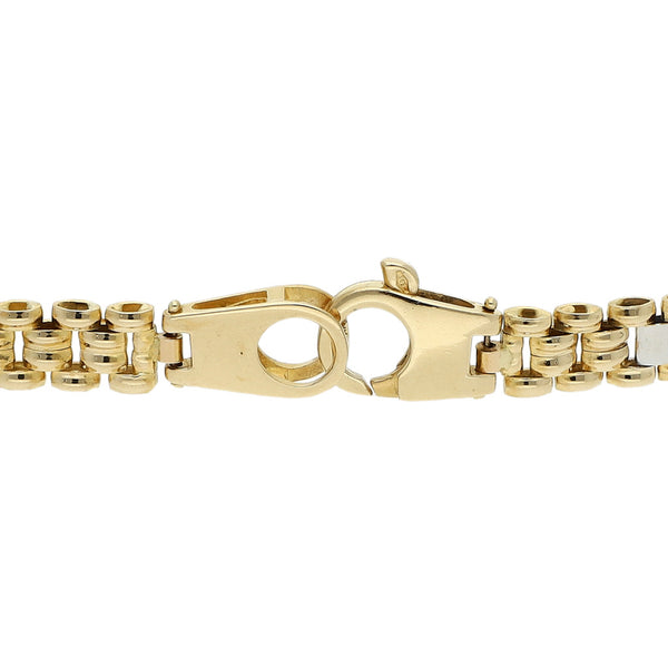 Pulsera eslabón articulado en oro dos tonos 14 kilates.