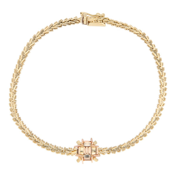 Pulsera eslabón boleado con aplicaciones en oro tres tonos 14 kilates.