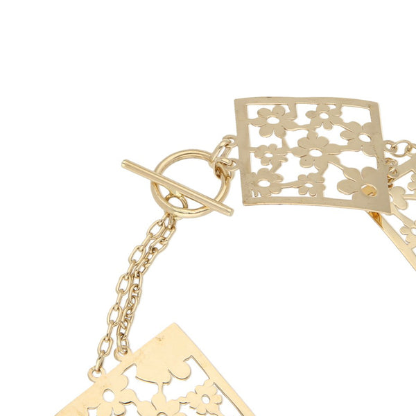 Pulsera de dos hilos eslabón cruzado con aplicaciones en oro amarillo 14 kilates.