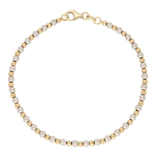 Pulsera eslabón boleado en oro dos tonos 14 kilates.