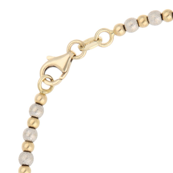 Pulsera eslabón boleado en oro dos tonos 14 kilates.