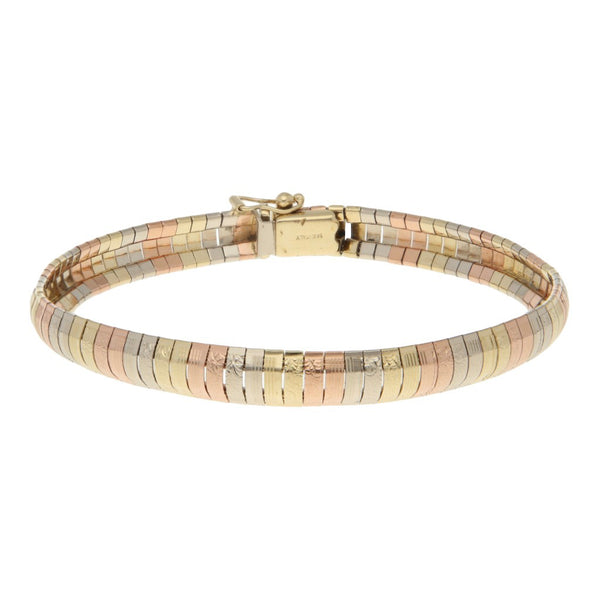 Pulsera eslabón articulado en oro tres tonos 14 kilates.
