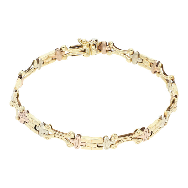 Pulsera eslabón articulado en oro tres tonos 14 kilates.