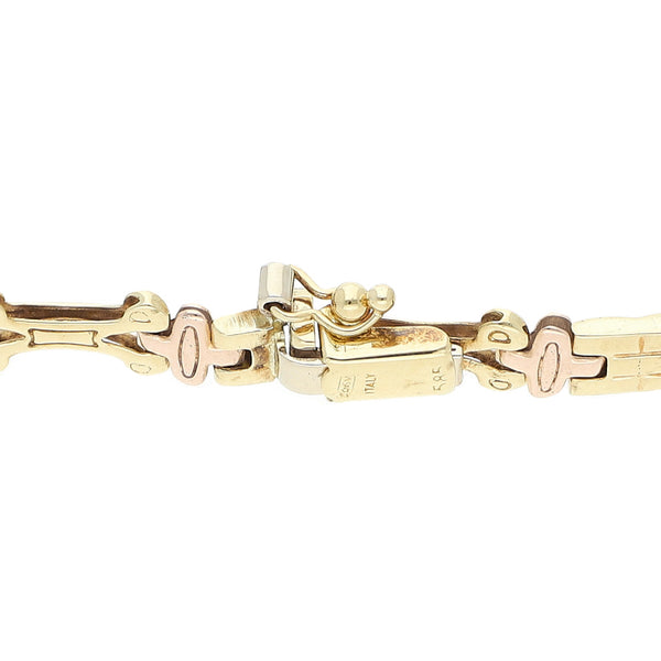 Pulsera eslabón articulado en oro tres tonos 14 kilates.