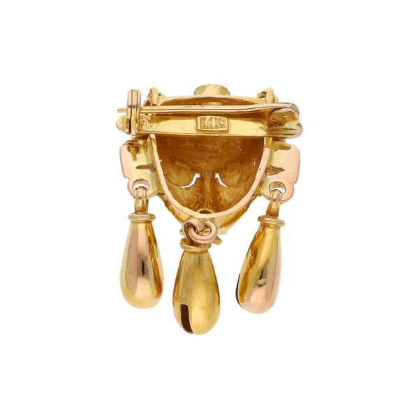 Prendedor diseño especial motivo mascara mixteca en oro amarillo 14 kilates.