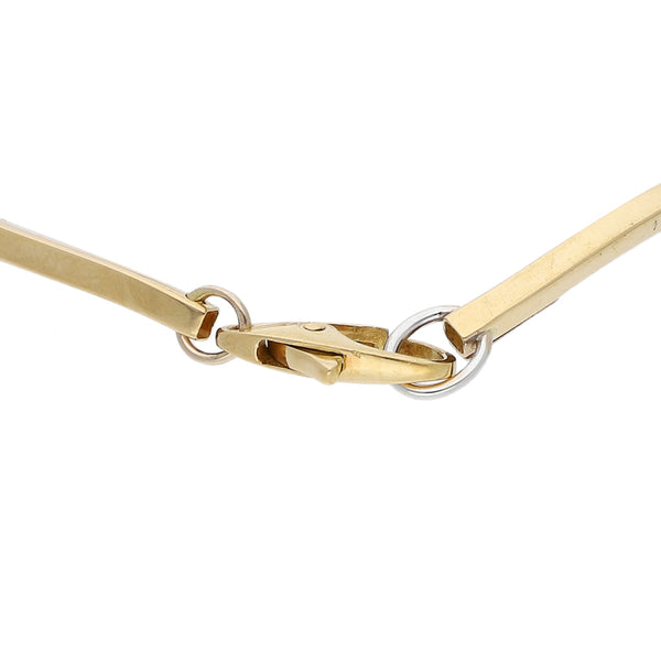 Pulsera eslabón articulado en oro dos tonos 18 kilates.