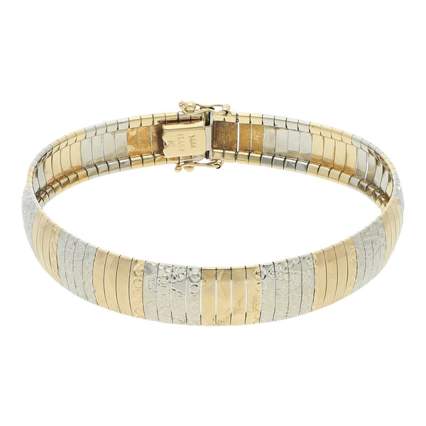 Pulsera eslabón laminado en oro dos tonos 14 kilates.