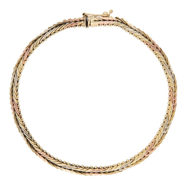 Pulsera eslabón boleado en oro tres tonos 14 kilates.