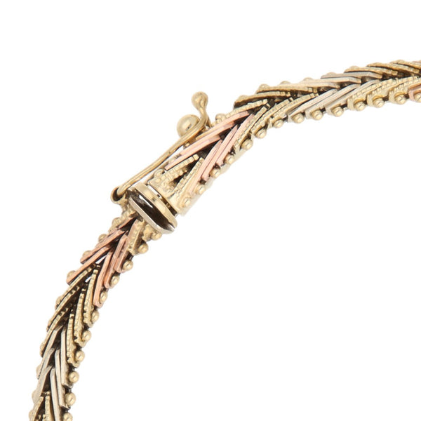 Pulsera eslabón boleado en oro tres tonos 14 kilates.