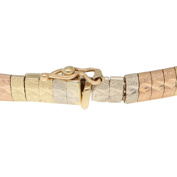 Pulsera eslabón laminado en oro tres tonos 14 kilates.