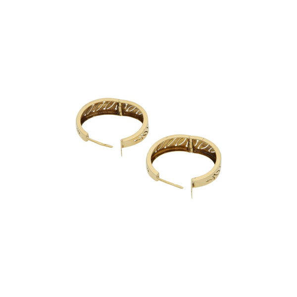 Arracadas articuladas en oro amarillo 14 kilates.