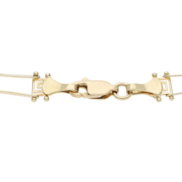 Pulsera eslabón articulado motivo grecas en oro amarillo 14 kilates.
