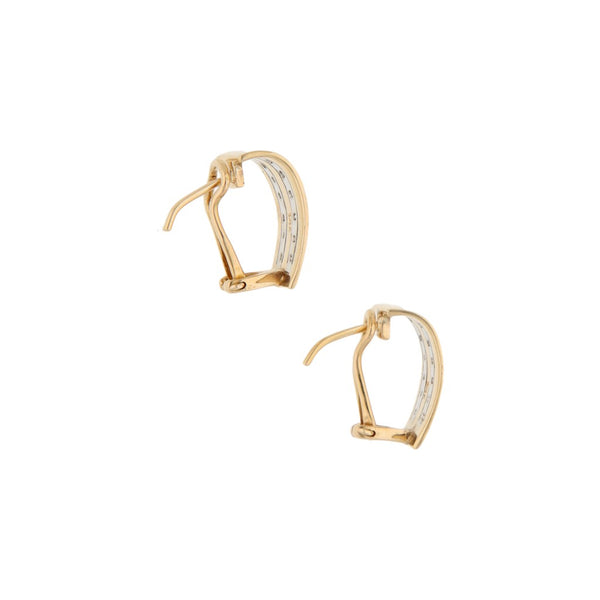 Aretes estilizados con diamantes en oro dos tonos 14 kilates.