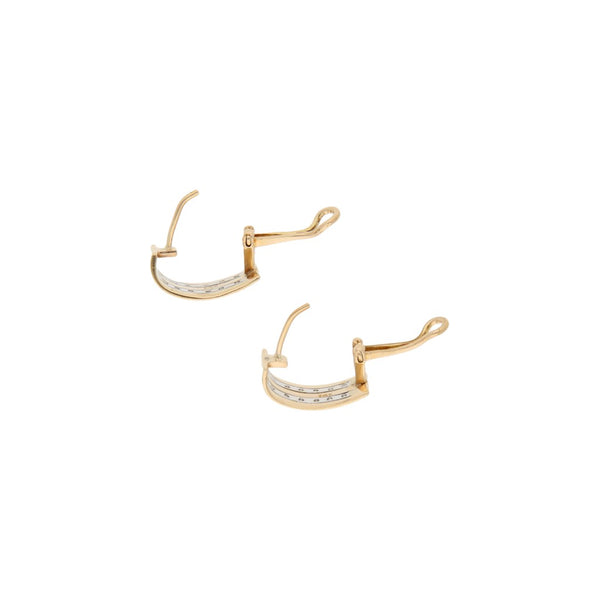 Aretes estilizados con diamantes en oro dos tonos 14 kilates.