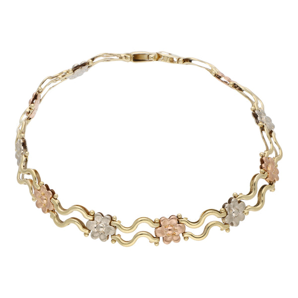 Pulsera eslabón articulado motivo flores en oro tres tonos 14 kilates.