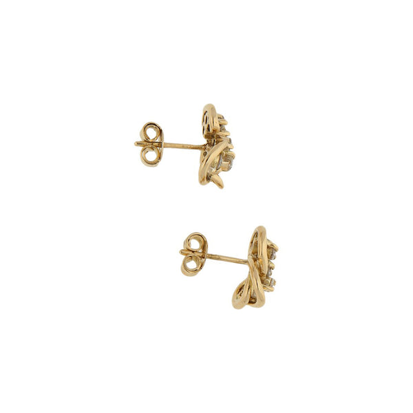 Broqueles estilizados con diamantes en oro amarillo 16 kilates.