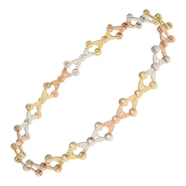 Pulsera de arillo calada en oro tres tonos 14 kilates.