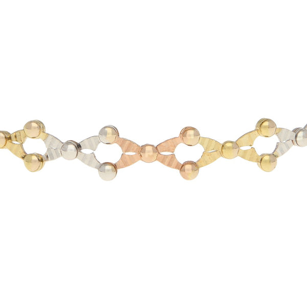 Pulsera de arillo calada en oro tres tonos 14 kilates.