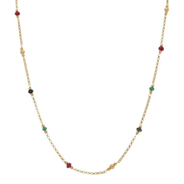 Collar eslabón cruzado con aplicaciones, esmeraldas, rubíes y zafiros en oro amarillo 18 kilates.