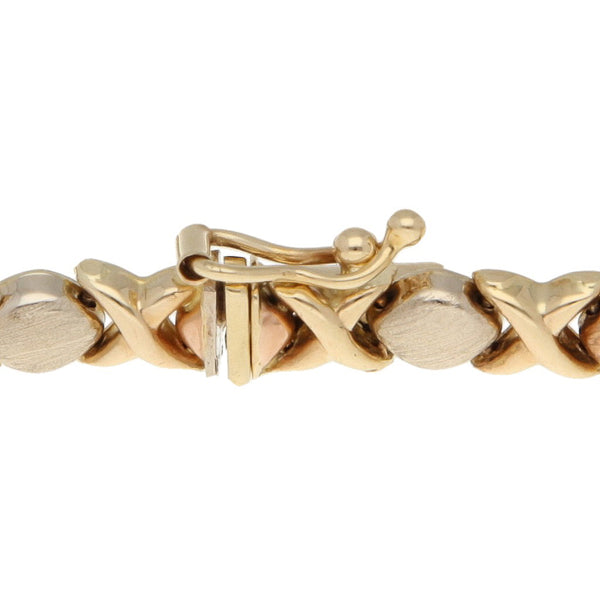 Pulsera eslabón XOXO en oro tres amarillo 14 kilates.