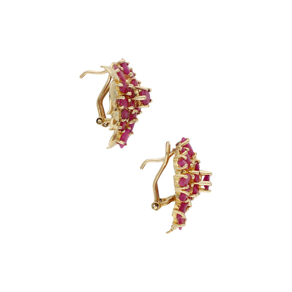 Aretes diseño especial con rubíes en oro amarillo 14 kilates.