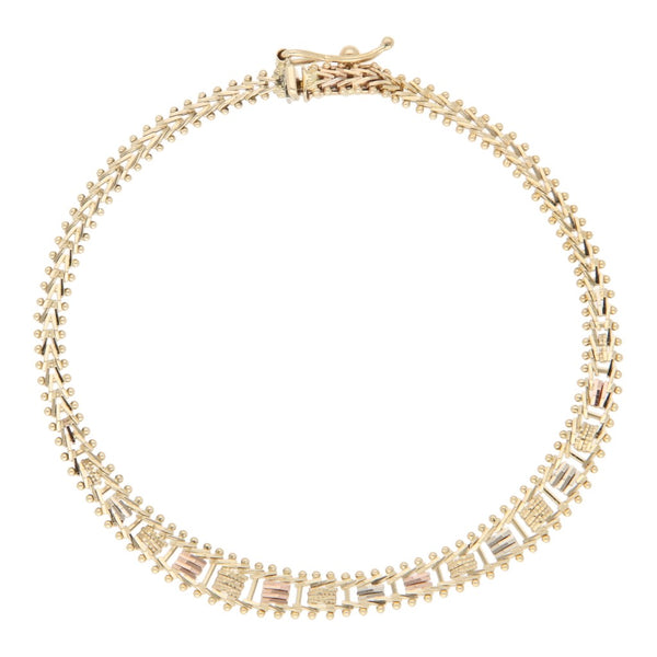 Pulsera eslabón boleado en oro tres tonos 14 kilates.