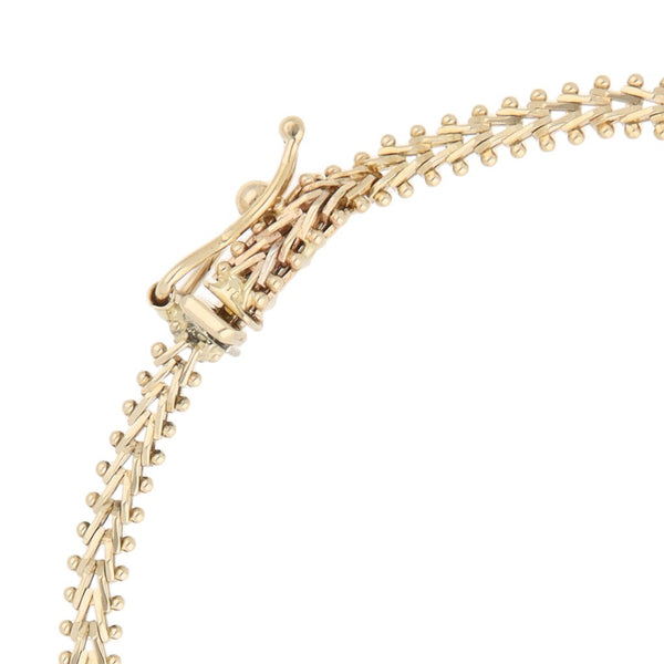 Pulsera eslabón boleado en oro tres tonos 14 kilates.