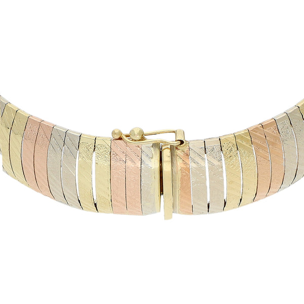 Pulsera eslabón planchado en oro tres tonos 14 kilates.