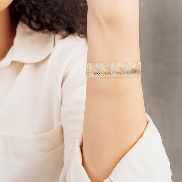 Pulsera eslabón planchado en oro tres tonos 14 kilates.