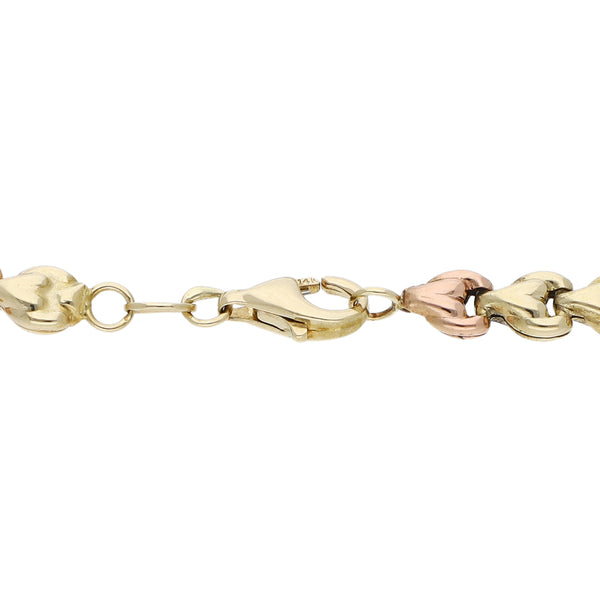Pulsera eslabón articulado en oro tres tonos 14 kilates.