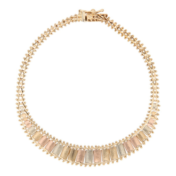 Pulsera eslabón boleado en oro tres tonos 14 kilates.