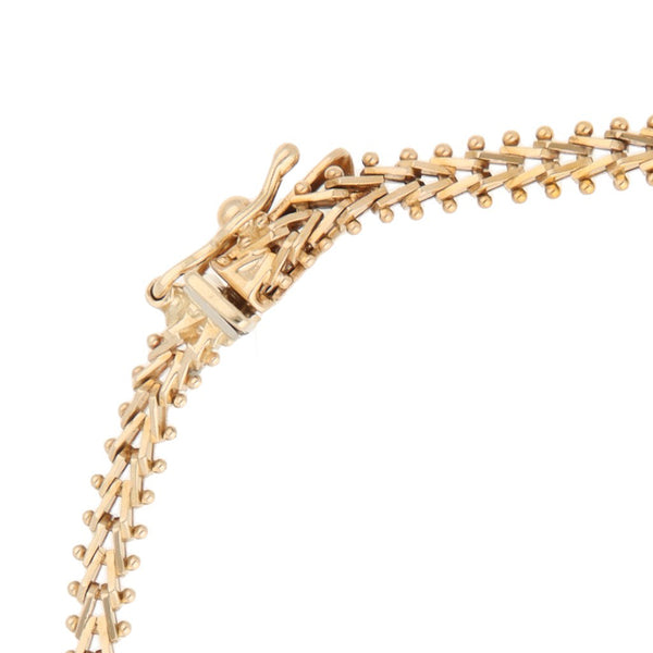 Pulsera eslabón boleado en oro tres tonos 14 kilates.