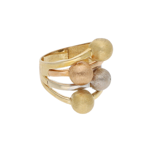 Anillo calado motivo esferas en oro tres tonos 14 kilates.