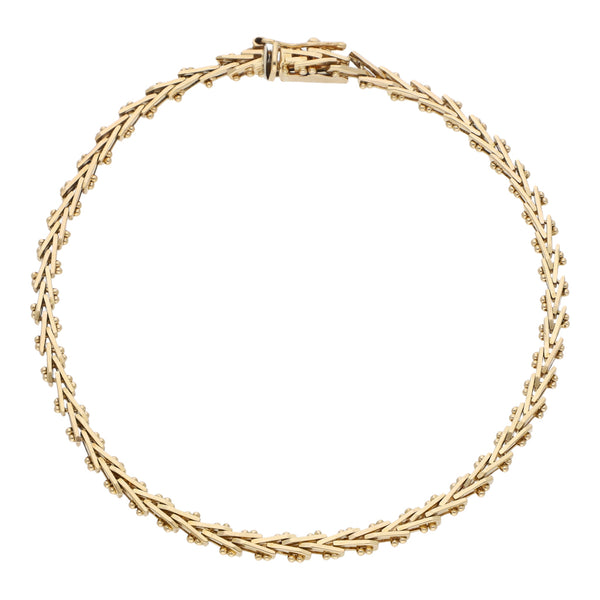 Pulsera eslabón boleado en oro amarillo 14 kilates.