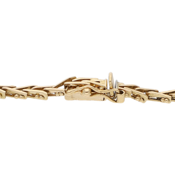 Pulsera eslabón boleado en oro amarillo 14 kilates.