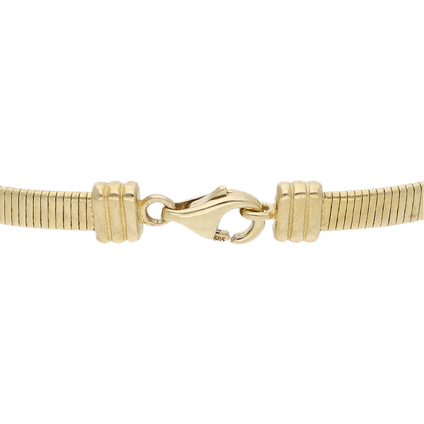 Pulsera infantil eslabón laminado con aplicación motivo ojo y esmalte en oro amarillo 14 kilates.