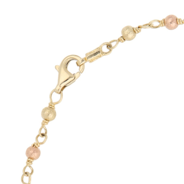 Pulsera tipo rosario eslabón cruzado en oro tres tonos 14 kilates.