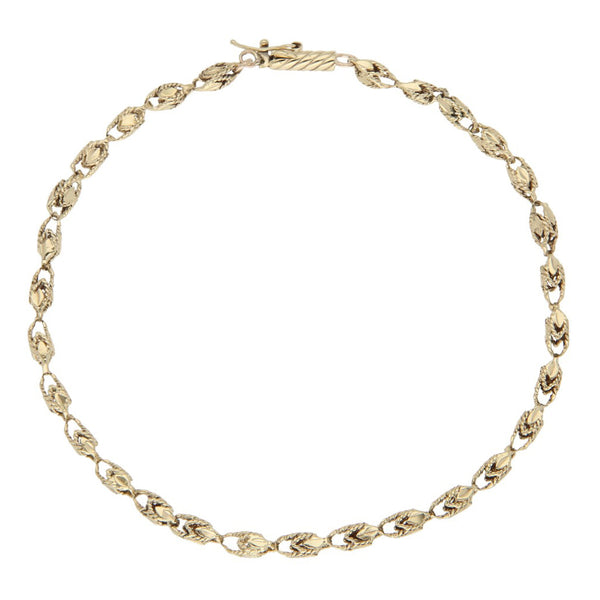 Pulsera eslabón laminado en oro amarillo 14 kilates.