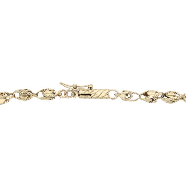 Pulsera eslabón laminado en oro amarillo 14 kilates.
