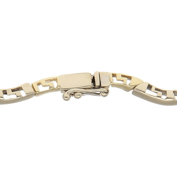 Pulsera eslabón articulado en oro dos tonos 14 kilates.