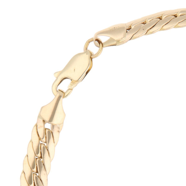 Pulsera eslabón barbado en oro amarillo 14 kilates.