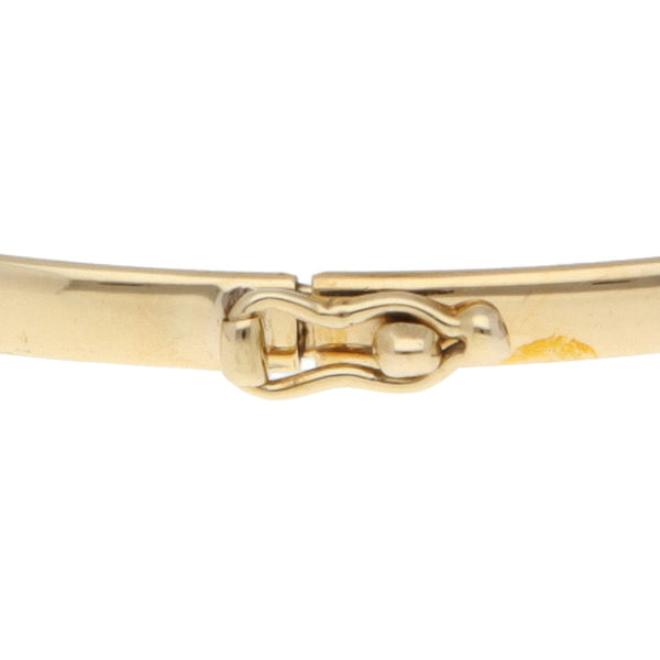 Pulsera de arillo laminada en oro amarillo 14 kilates.