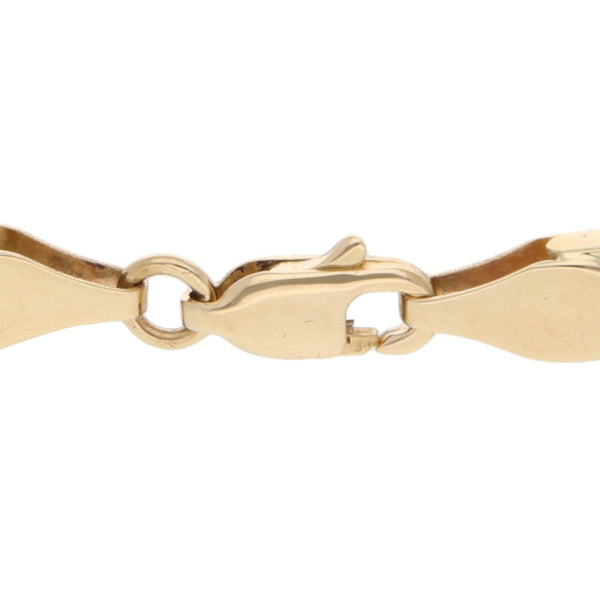 Pulsera eslabón articulado en oro dos tonos 14 kilates.