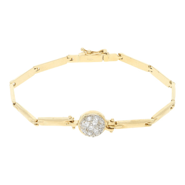 Pulsera eslabón articulado con aplicación de sintéticos en oro amarillo 18 kilates.