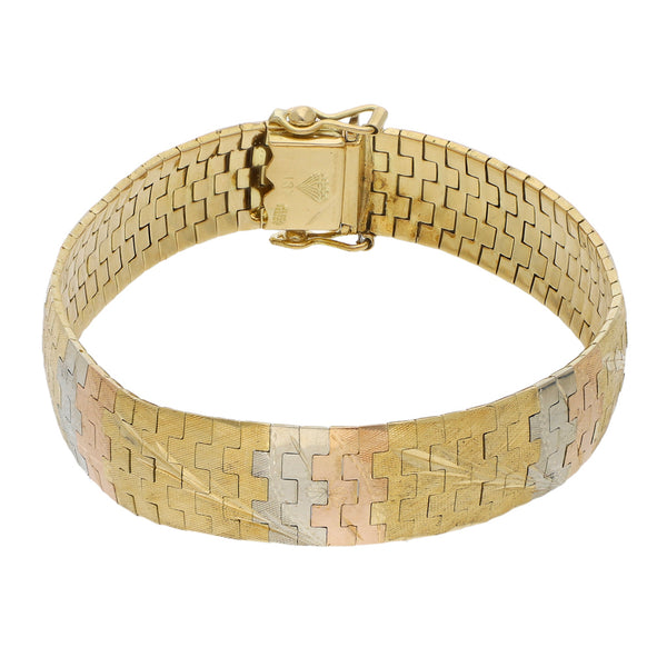 Pulsera eslabón articulado en oro tres tonos 18 kilates.
