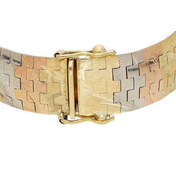 Pulsera eslabón articulado en oro tres tonos 18 kilates.