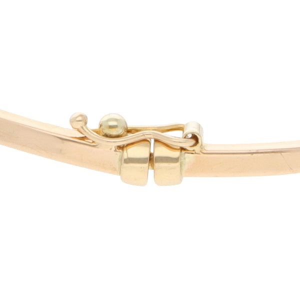 Pulsera de arillo articulada con aplicaciones motivo osos y circonias en oro dos tonos 14 kilates.